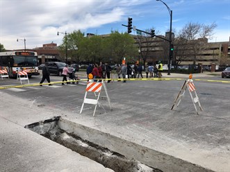 Flaggers lending assistance to keep pedestrians clear of the work zone (2)