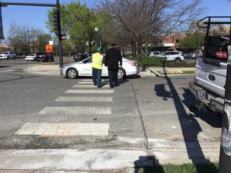 Flaggers lending assistance to keep pedestrians clear of the work zone (1)